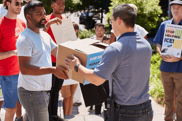Protesters deliver a box of signatures Protesters deliver a box of signatures