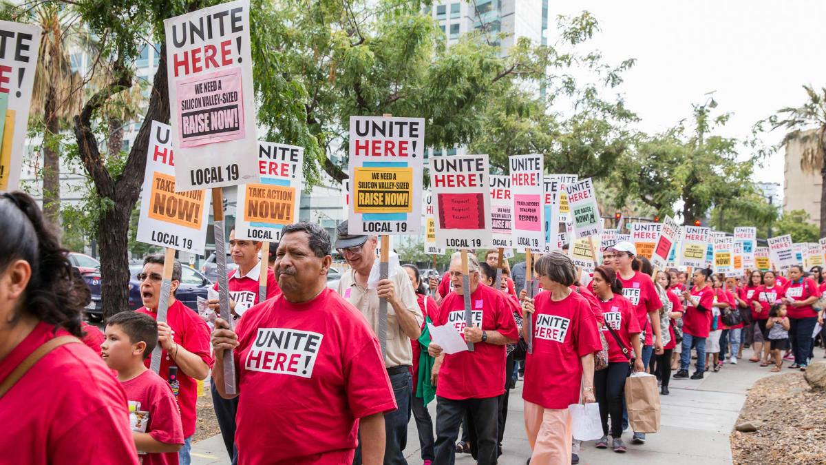 Members of Unite Here Local 19 demonstrate for a raise Members of Unite Here Local 19 demonstrate for a raise
