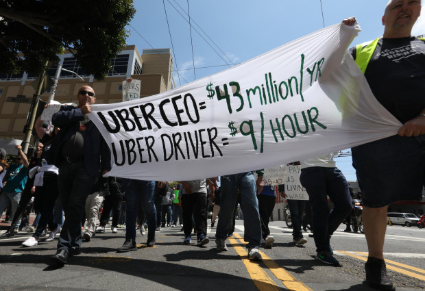 A banner at the Uber protest on May 8, contrasting the income of Uber's CEO and its drivers A banner at the Uber protest on May 8, contrasting the income of Uber's CEO and its drivers