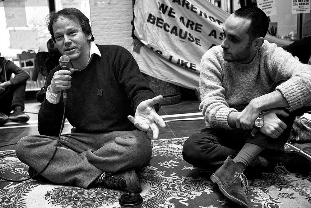 Photo of David Graeber speaking in front of a crowd at Occupy Photo of David Graeber speaking in front of a crowd at Occupy