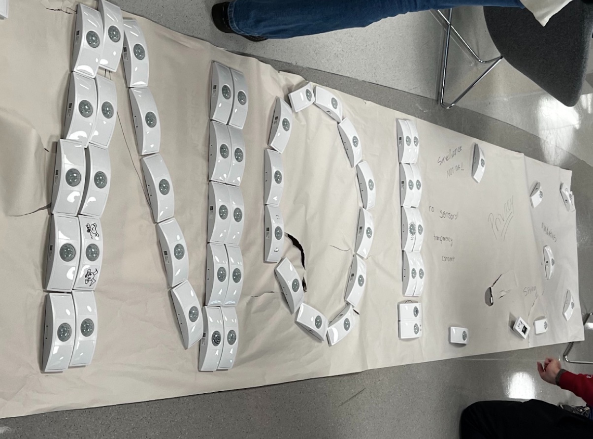 A few dozen motion sensor devices arranged on the floor to spell out NO! A few dozen motion sensor devices arranged on the floor to spell out NO!